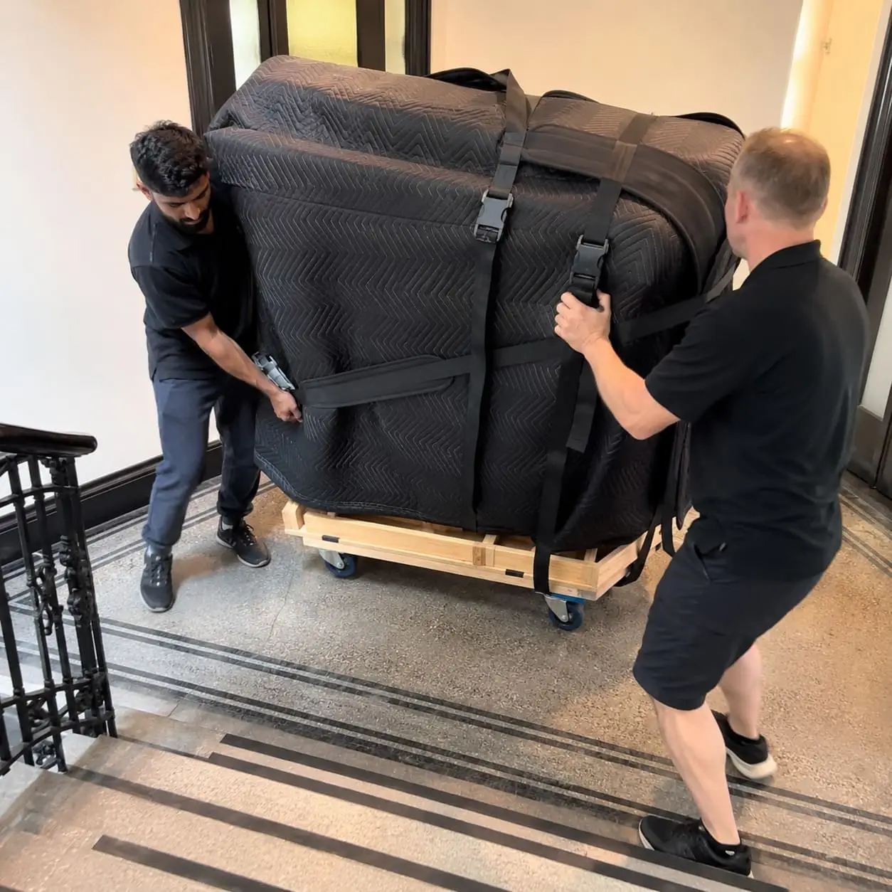 Expert piano movers navigating tight stair landings – Piano Removals