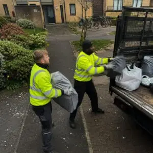Flat rubbish removal team loading bulky waste - Rubbish Removals