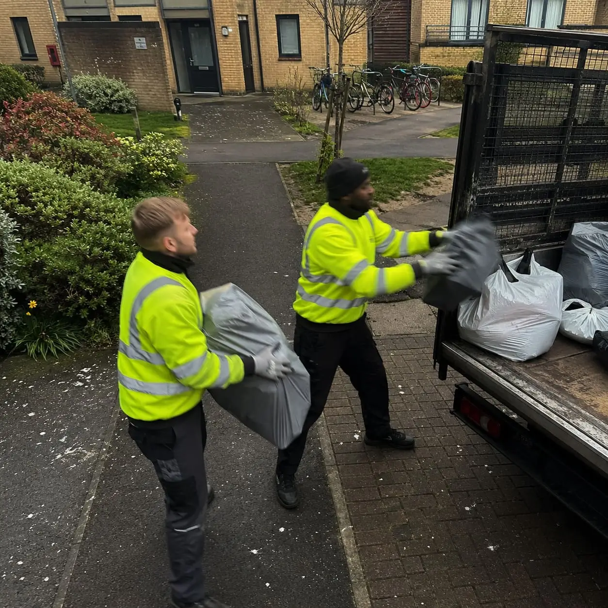 Flat rubbish removal team loading bulky waste - Rubbish Removals