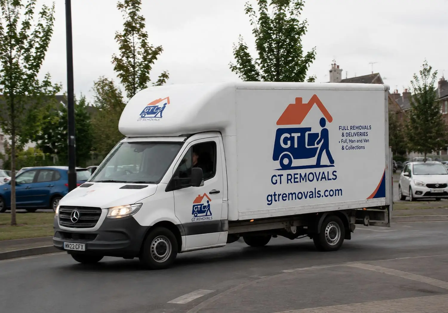 GT Removals van outside the company base on Deer Park Road in Wimbledon SW19
