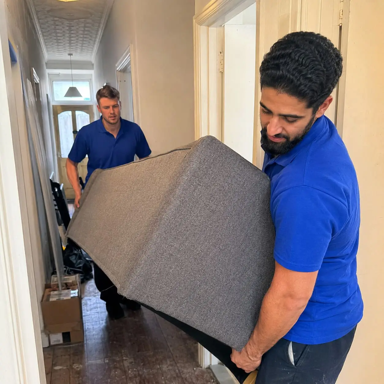 GT Removals team handling furniture during a house move