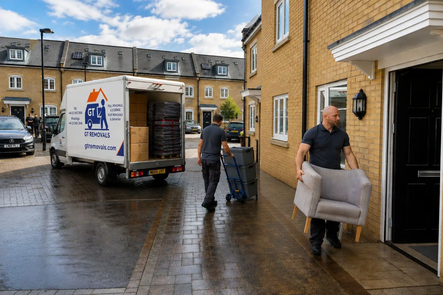 Removals movers unloading furniture from van into townhouse – House Removal Service