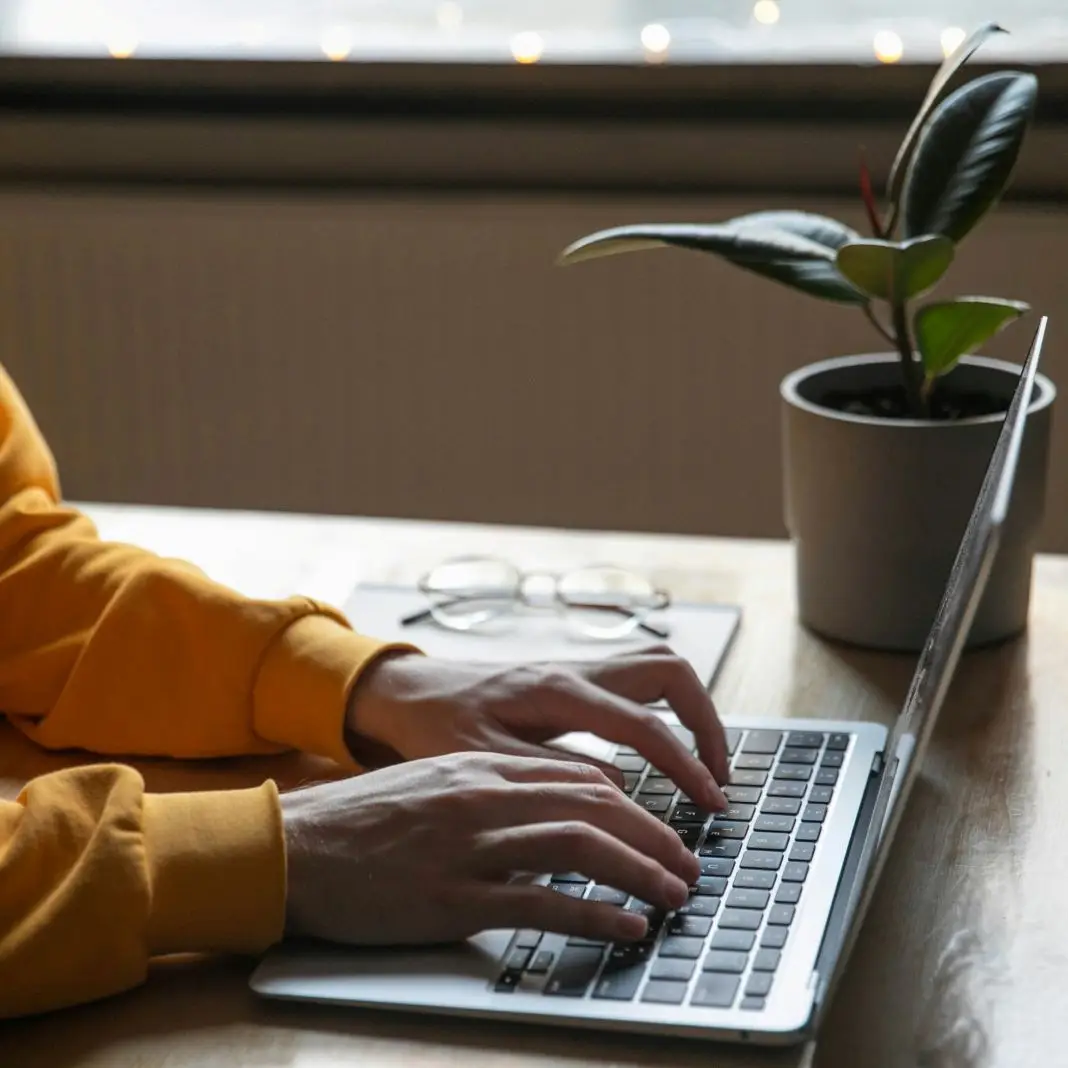 A photo of a student working on their laptop